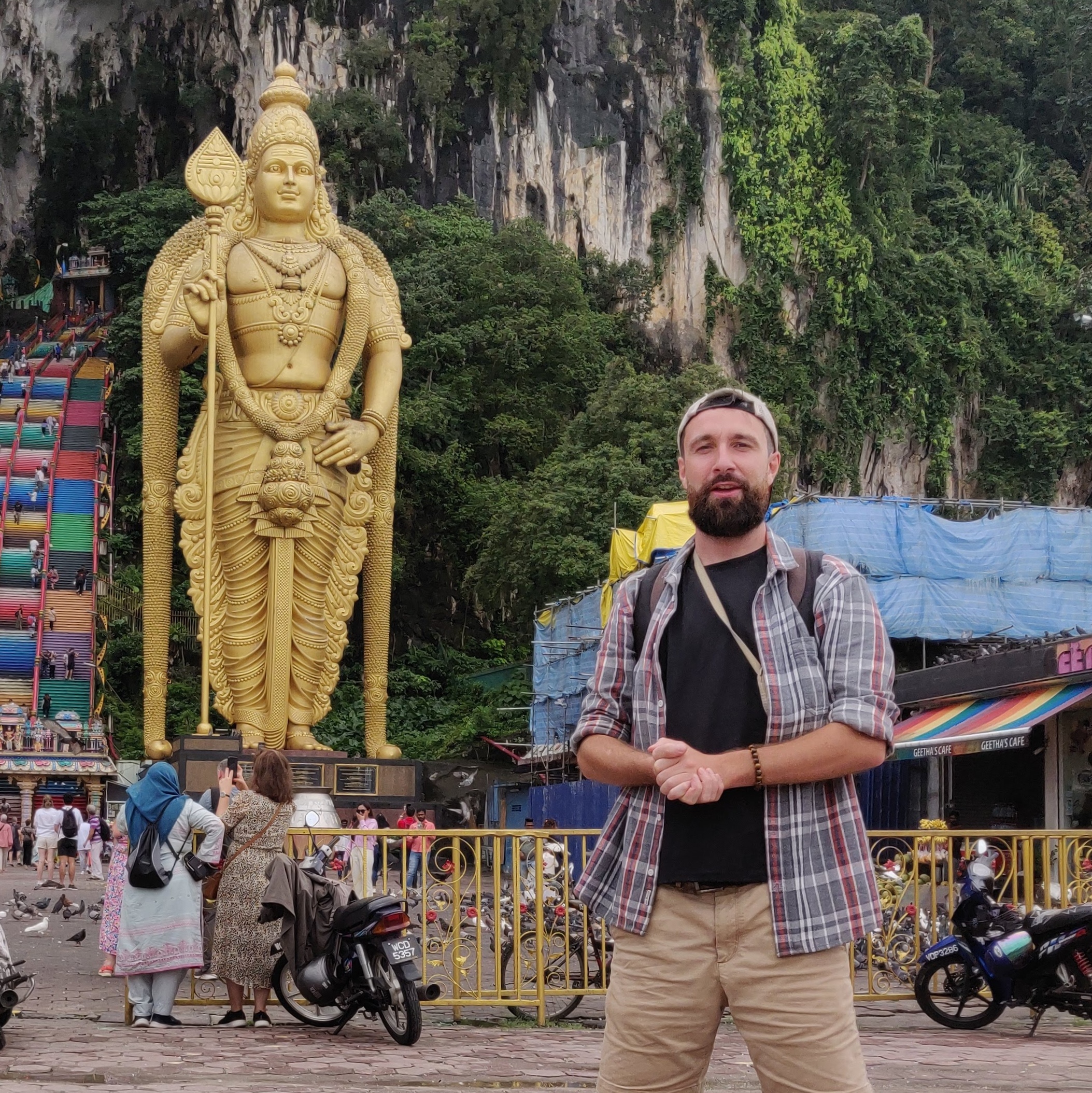 Niall Harrington standing in front of the temple cave in Kuala Lumpur